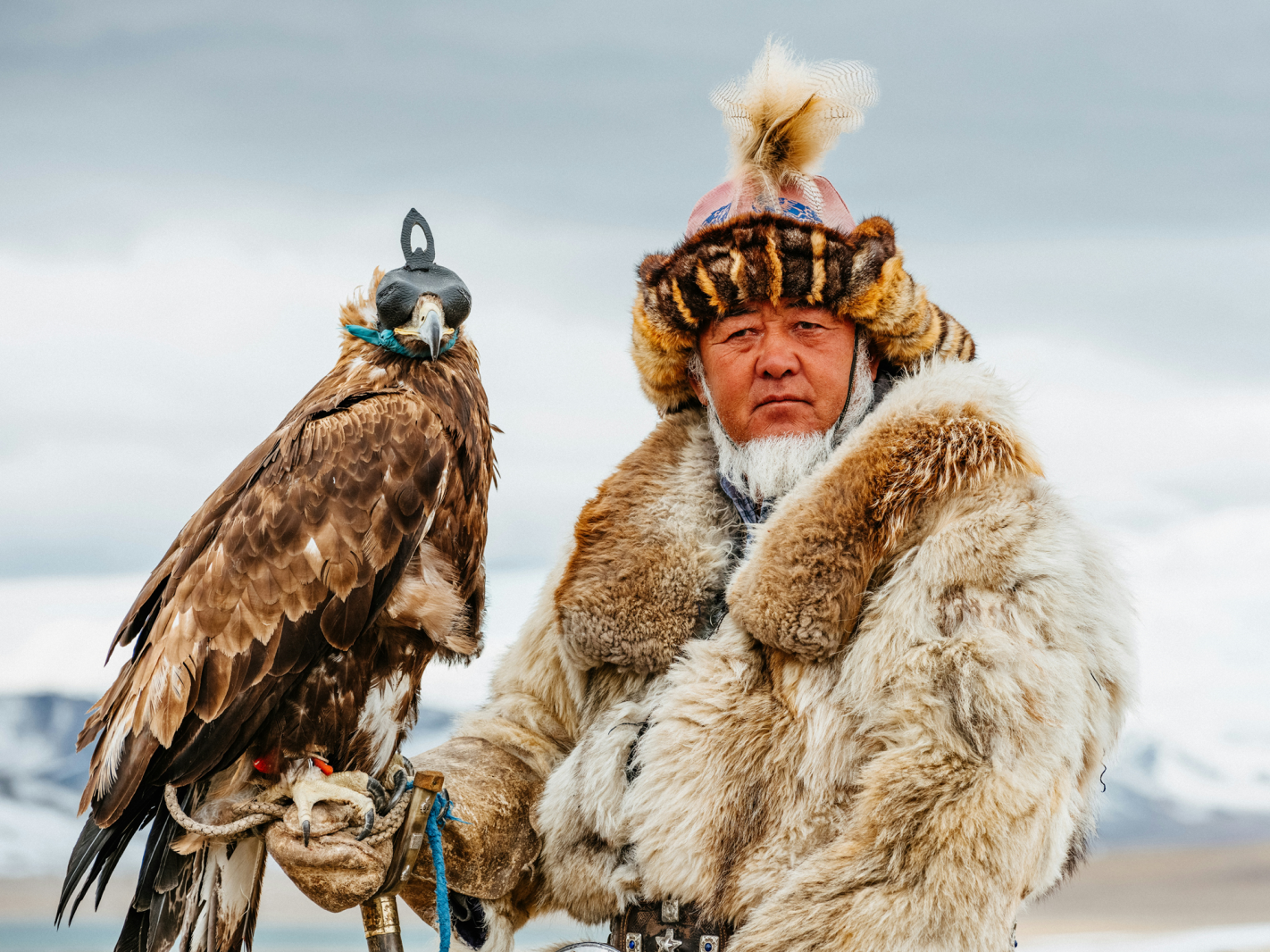 An Eagle Hunter with his golden Eagle during the Golden Eagle Festival in Mongolia