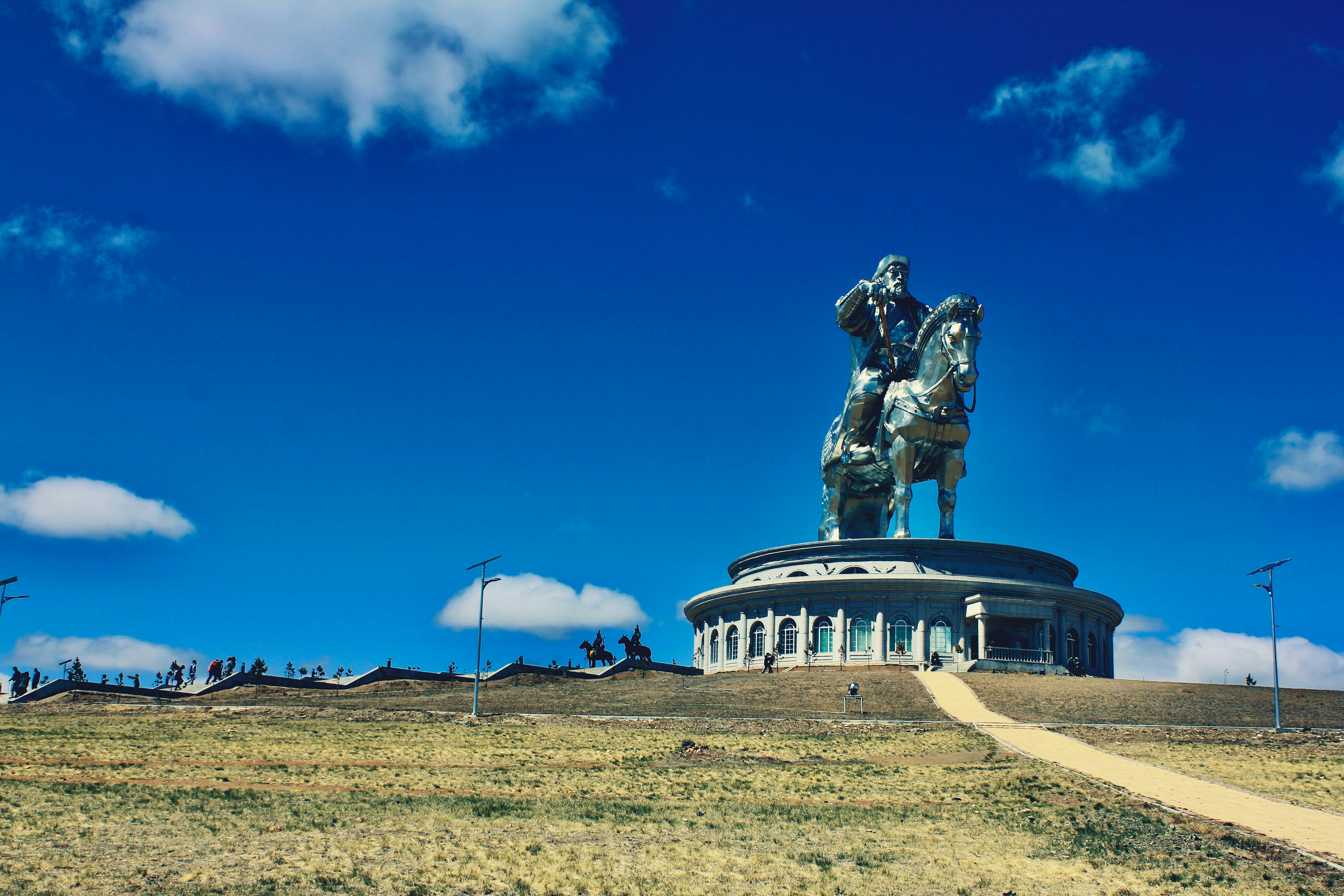 Genghis Khaan Statue At Tsonjin Boldog, stretching across the horizon under a clear blue sky.